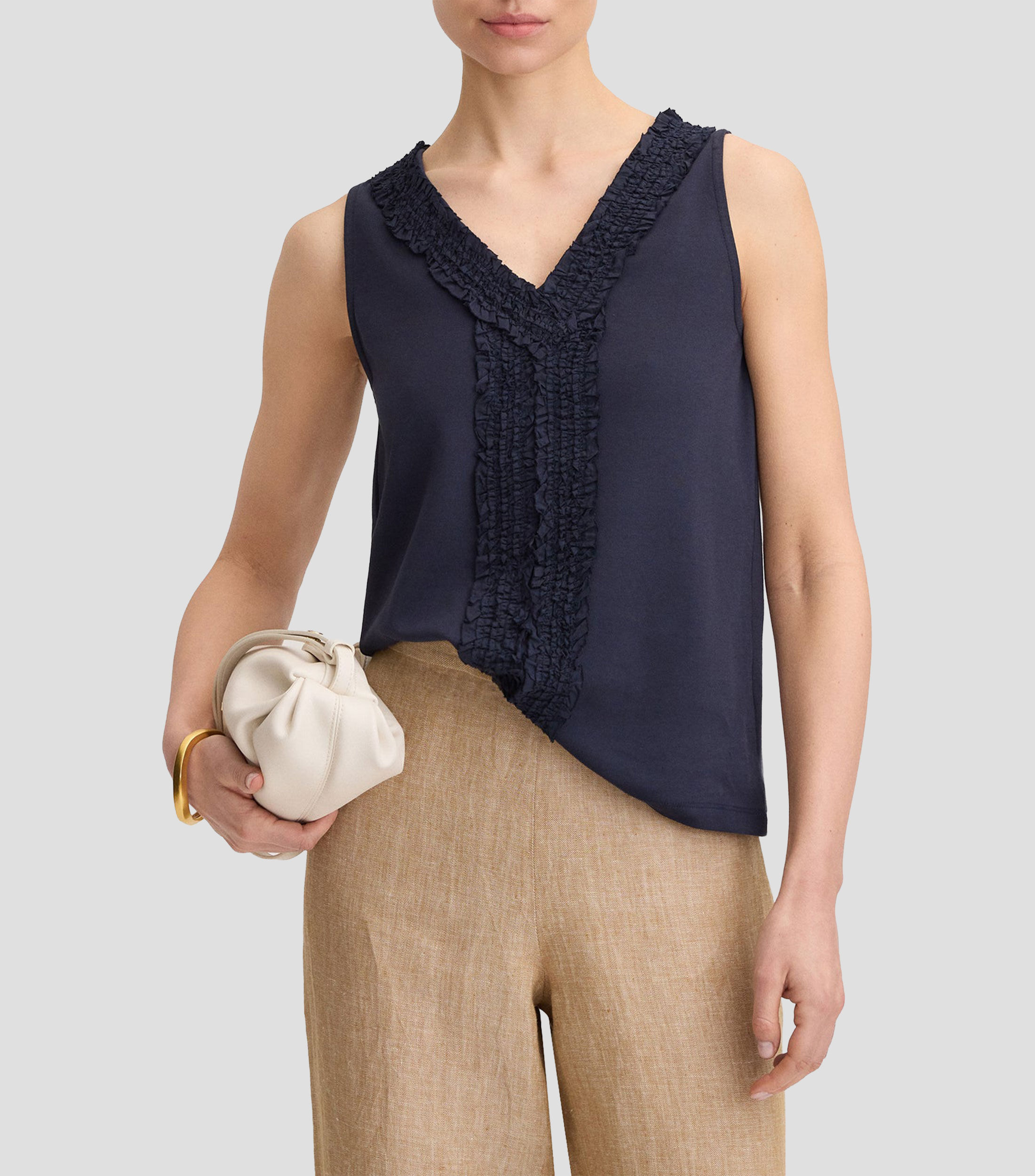 Blusa fantasía sin mangas Mujer